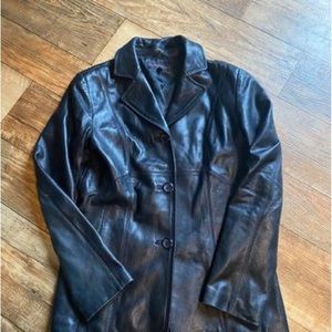 Very nice medium black women’s leather coat.